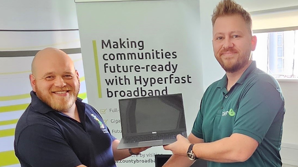 Pictured:  Craig Larter, Stakeholder Engagement Manager, making the donation to James Tombs, Senior Business Development Manager at Tier 1, which is facilitating the laptop recycling for Digital Essex.